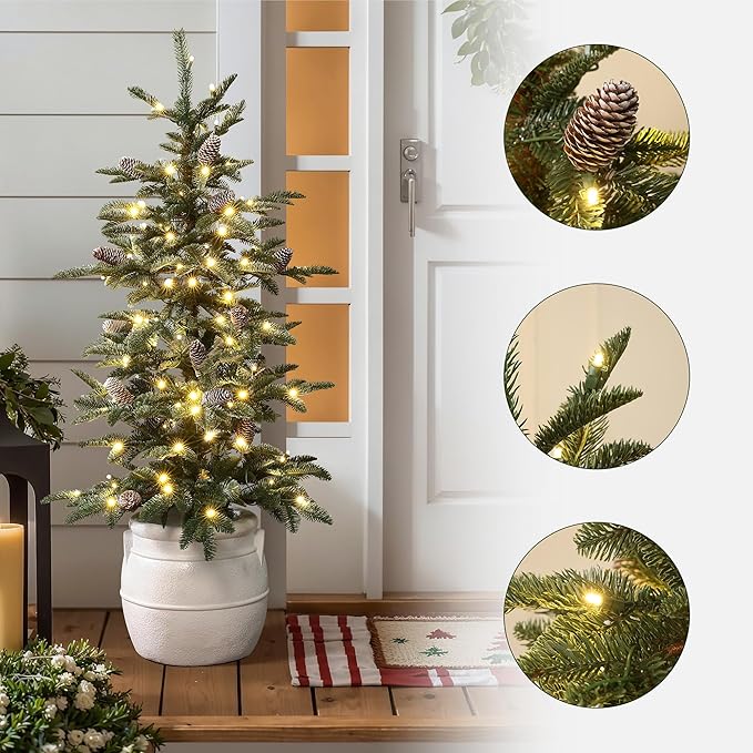 LuxenHome 4FT Small Christmas Tree, Slim Potted Christmas Trees with 100 Warm White LED Lights, Artificial Pine Tree with Pine Cone and White Round Base, Faux Tree for Holiday Decorations