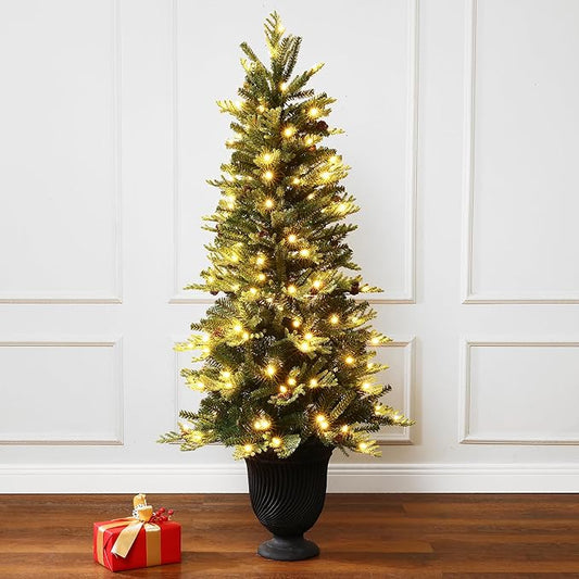 LuxenHome 4.5FT Potted Christmas Tree, Prelit Artificial Small Christmas Trees with 150 LED Lights, Slim Xmas Tree Pre-lit with Pine Cone and Black Fluted Urn Style Pot for Entryway, Living Room