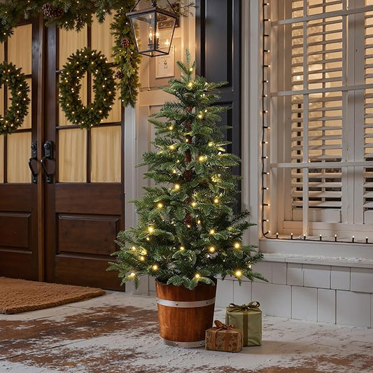 LuxenHome 4FT Small Christmas Tree, Prelit Slim Potted Christmas Trees with 100 Warm White LED Lights, Realistic Fir Tree with Rustic Wood Barrel Planter for Entrance, Hallway Holiday Decorations